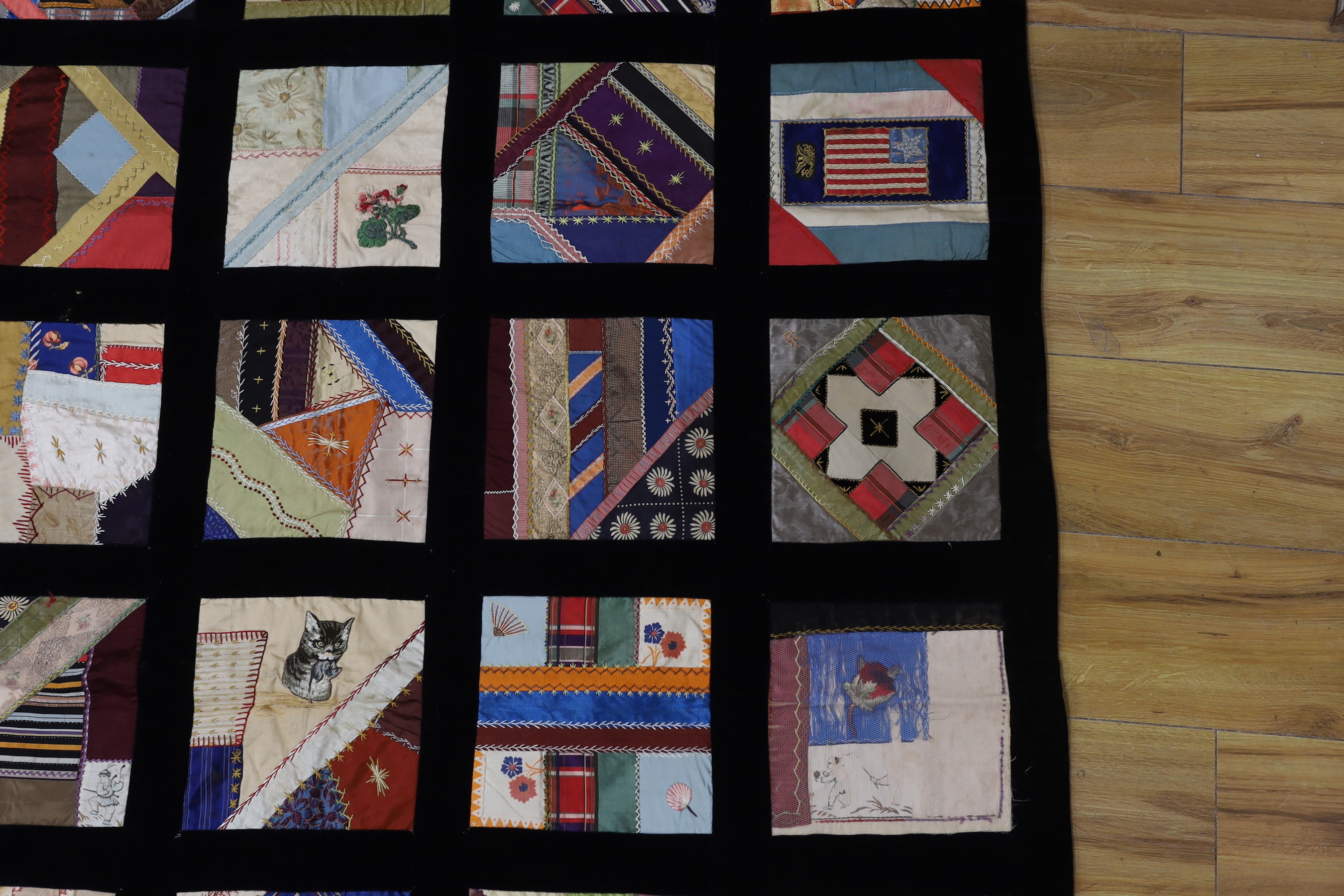 A 19th century crazy patchwork quilt worked with silks and velvets in novelty motifs